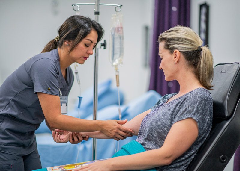 Nurse-checking-on-patient-receiving-ketamine-infusion