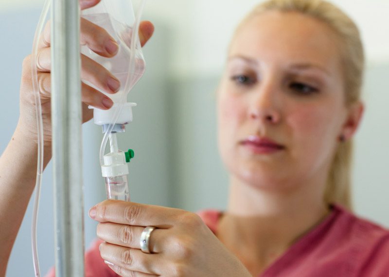 Nurse-preparing-ketamine-IV-treatment-for-patient-with-opioid-addiction