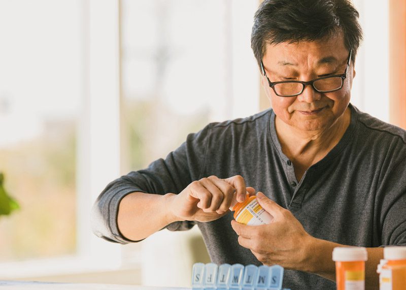 Senior-man-sorting-medication