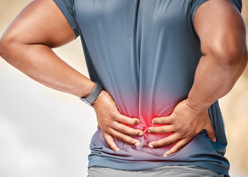 man-stopping-exercise-to-feel-back-pain